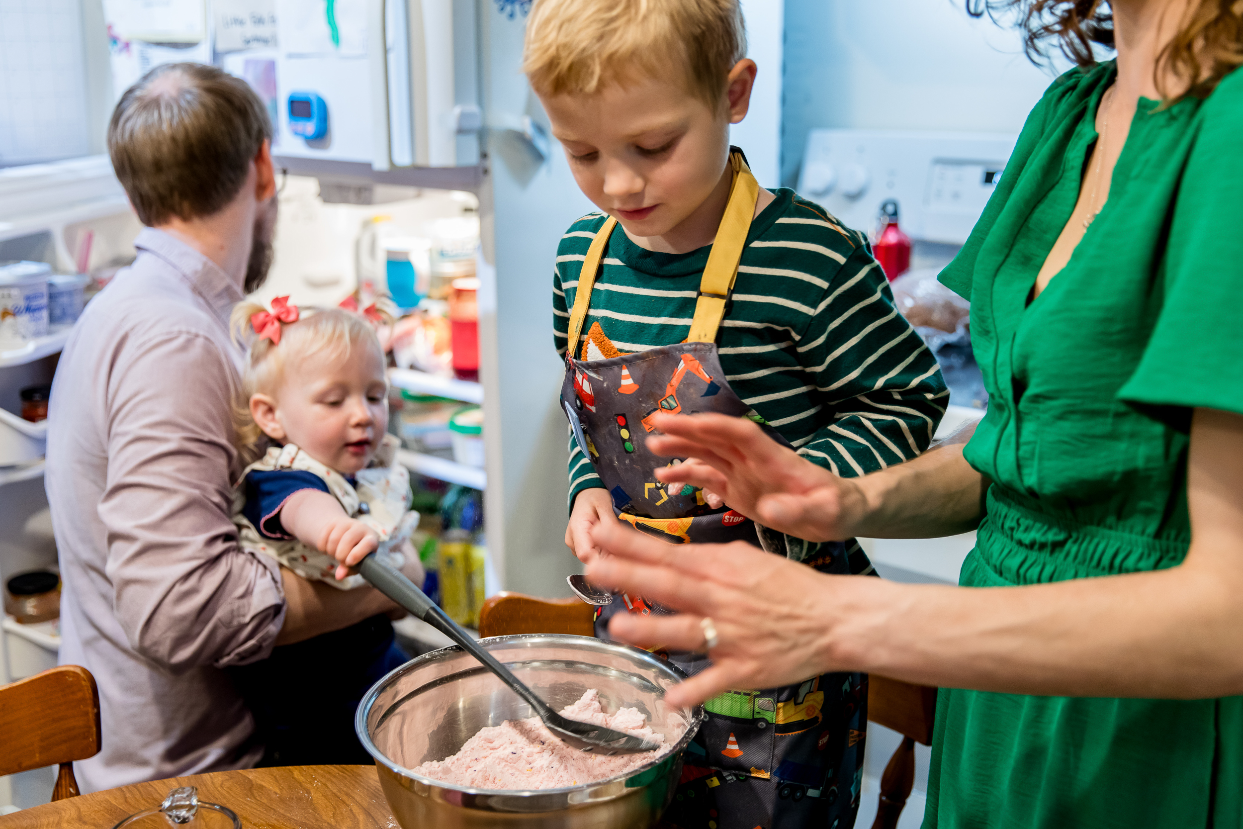 slight kitchen chaos as family makes cupcakes all together